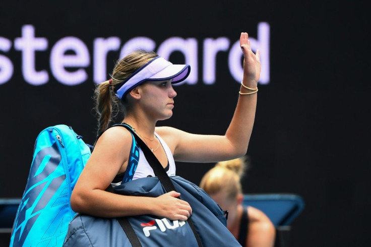 All over: Sofia Kenin waves to fans as she leaves Margaret Court Arena after losing in straight sets to end her Australian Open defence at the second-round stage
