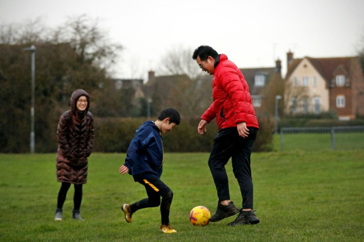 Connie Chan (L), Winston Wong (R) and their son Cheston are among some 7,000 Hong Kongers who left for Britain last year as China cracks down on dissent