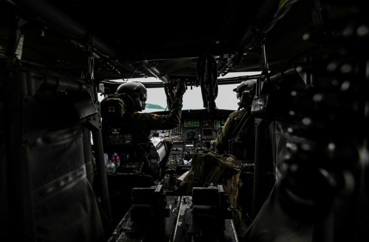 Colombian police pilots on board a helicopter during an operation to eradicate illicit coca crops in December 2020