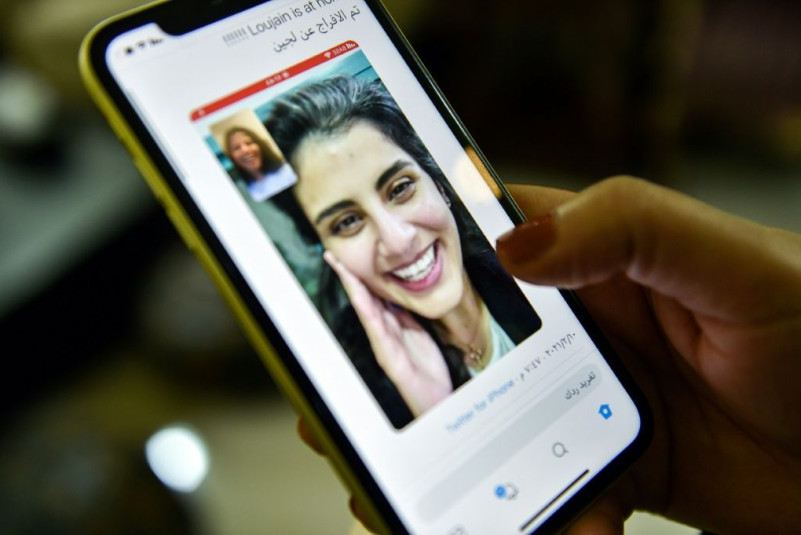 A tweet posted by the sister of Saudi activist Loujain al-Hathloul, Lina, shows a screenshot of the two of them conducting a video call following Hathloul's release after nearly three years in detention