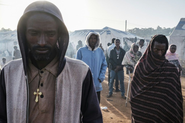 Almost unknown to the outside world, an ethnic conflict in Metekel, western Ethiopia, has left hundreds of dead and forced tens of thousands from their homes. Pictured: A camp for displaced people at Chagni