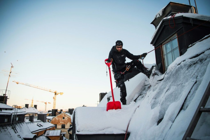 The constant clearing of snow from the city's roofs is first and foremost done for people's safety, but also to maintain the buildings, many of which are hundreds of years old
