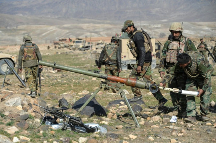 Afghan security forces fire on Taliban positions during an operation against Taliban militants in the Sherzad District of Nangarhar Province on February 9,2021