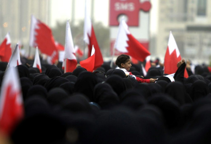 Bahraini Shiite anti-government protesters take part in a rally in remembrance of the seven people who were killed in police crackdowns as they march towards Pearl Square in Manama on February 25, 2011