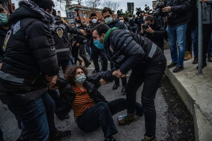 Turkish police detain a woman during a demonstration outside Bogazici University in Istanbul on February 1, 2021 after President Recep Tayyip Erdogan accused LGTQI rights activists of "vandalism"