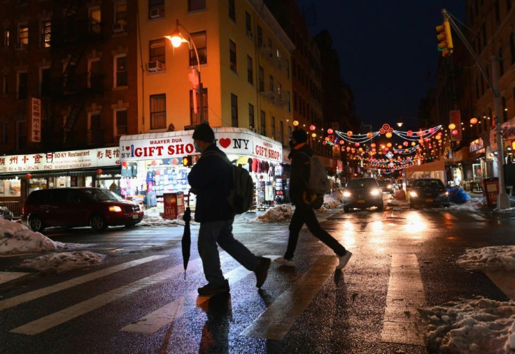 People walk through Chinatown in New York City on February 11, 2021