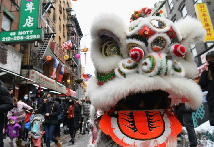 People celebrate the Lunar New Year holiday in Chinatown on February 12, 2021 in New York City