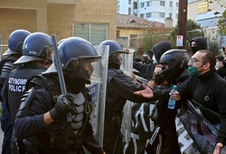 Cypriot police said they had arrested eight people during the protest