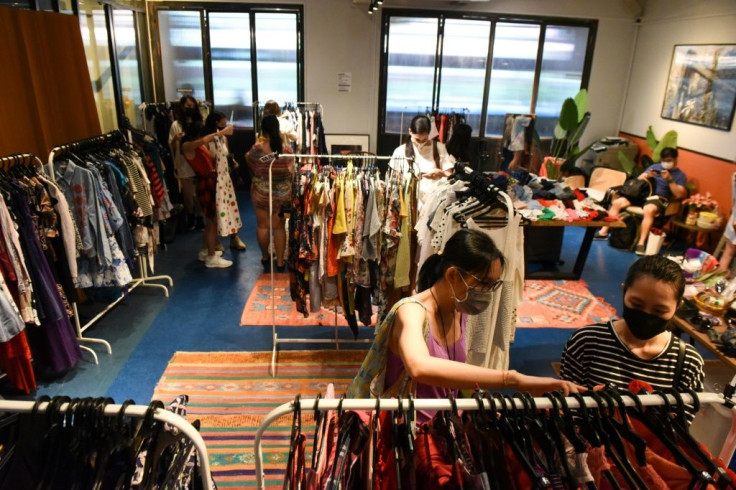 Shoppers browse second-hand clothes at a pop-up swap event organised by a group of volunteers in Singapore