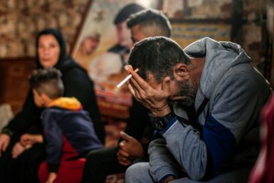 Hadi, the father of one of four boys from the Bakr family killed in Israeli fire while playing on a beach during the 2014 war in Gaza, gathered with relatives under images of the slain boys at a family home in the Al-Shati refugee camp this month