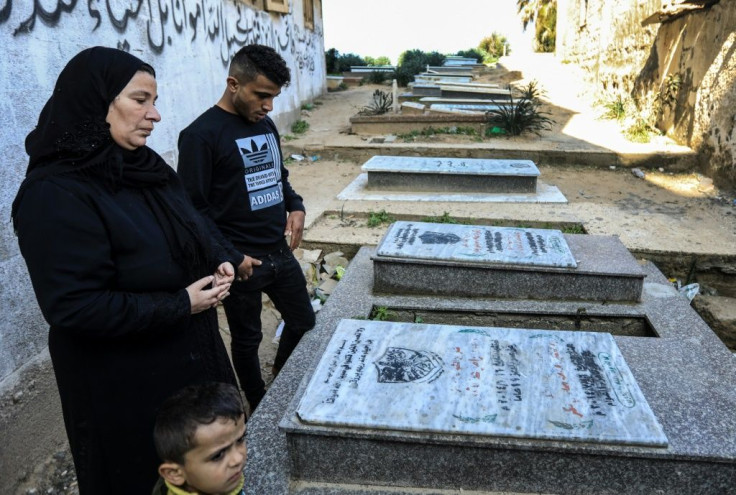 Sayed Bakr, who survived the airstrike that killed four of his relatives, visited his brother's grave with his mother in the Al-Shati refugee camp in Gaza City