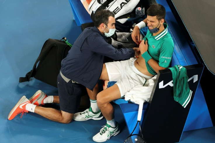 Serbia's Novak Djokovic struggled with an abdominal injury during his win against Taylor Fritz