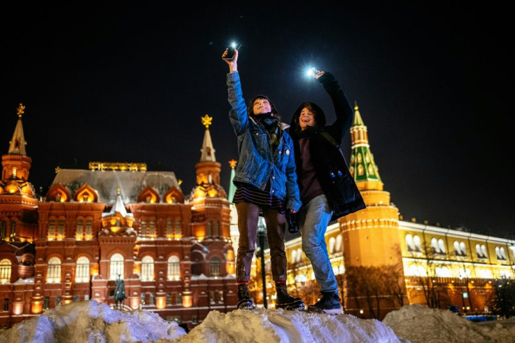 Mobile phone lights showed support for jailed opposition politician Alexei Navalny near Red Square in Moscow and in many other parts of the country