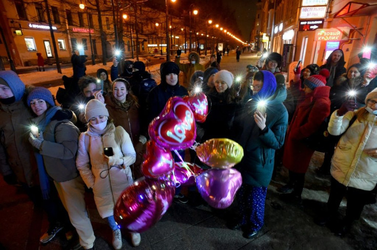 Navalny's team released pictures and videos of gatherings across the country where Russians lit flashlights, sparklers and small lanterns