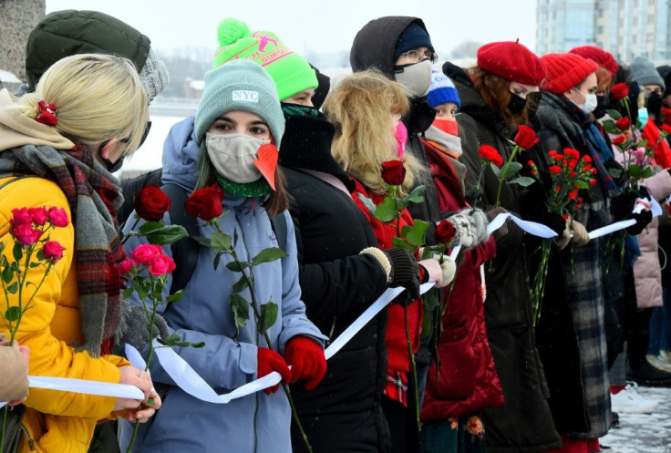 "By forming a chain we want to show that we are for love and against violence," a 22-year-old student told AFP