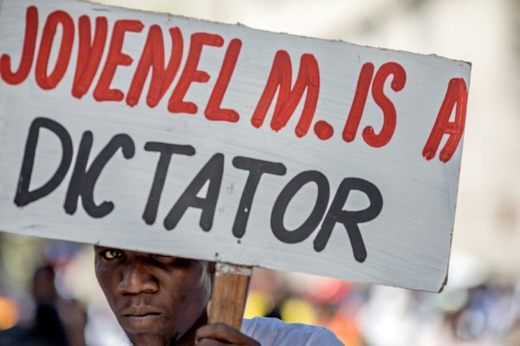 Demonstrators march in Port-au-Prince on February 14, 2021, to protest against the government of Haitian president Jovenel Moise