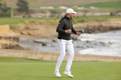 American Daniel Berger celebrates his eagle putt at 18 for victory in the US PGA Tour Pebble Beach Pro-Am