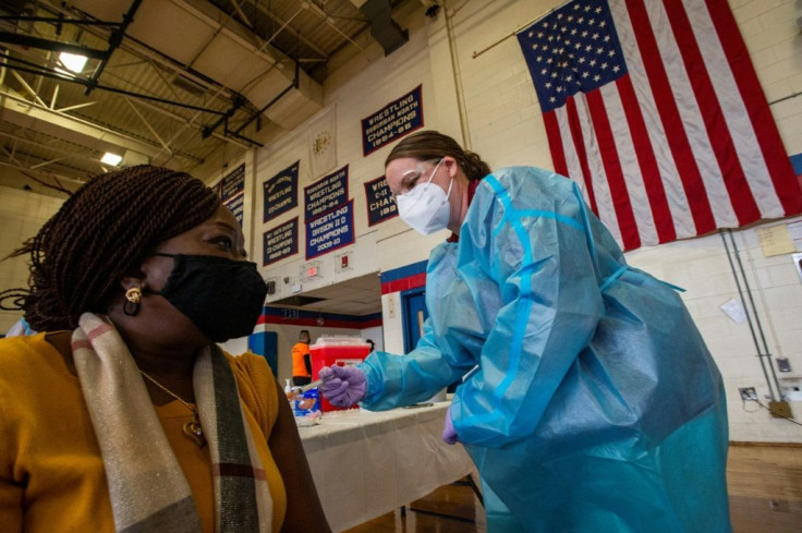 Doris Norman gets the Covid-19 vaccine in the United States, where minorities have died from the virus at higher rates than whites