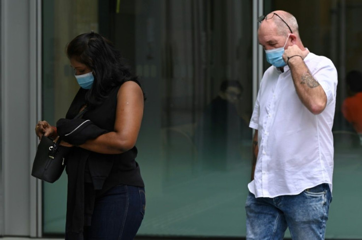 Briton Nigel Skea and his Singaporean wife Agatha Maghesh Eyamalai at the State Court in Singapore
