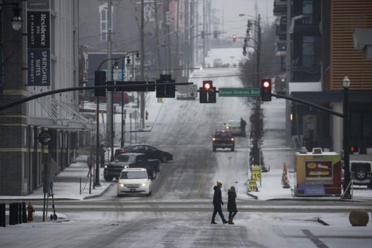 Pedestrians in Nashville, Tennessee, after freezing temperatures coated the city in ice