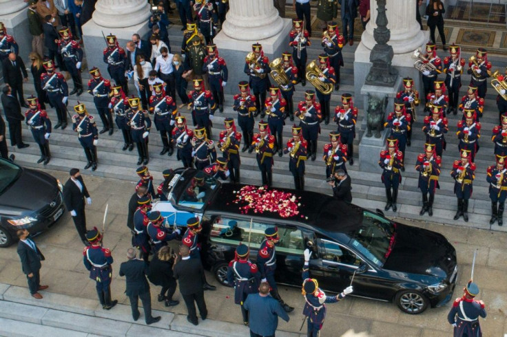Aerial view of the honour guard carrying the coffin of late former Argentine president (1989-1999) Carlos Menem into a hearse outside the Congress in Buenos Aires before the funeral cortege