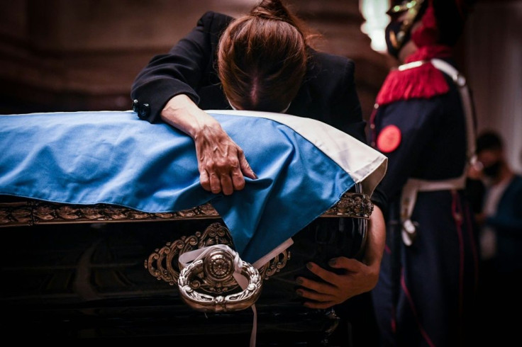 Zulema Menem embraces the coffin of her father, former Argentine president (1989-1999) Carlos Menem as he lies in state at the Congress in Buenos Aires