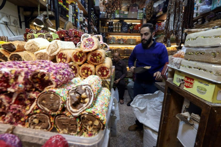 An Iraqi man sells nuts in the old bazaar in Arbil, the capital Iraqi Kurdistan: shopkeepers offer the tradition of istiftah to the first customer of the day