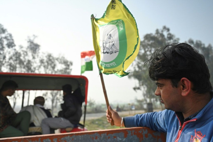 Tractors carrying donations, blasting out music and flying flags in support of the protests go to and from the villages