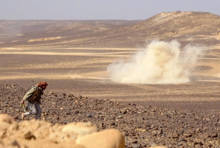 Smoke billows during clashes between forces loyal to Yemen's Saudi-backed government and Huthi rebel fighters near Marib