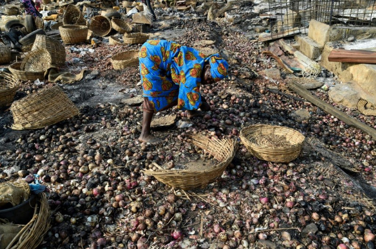 Traders picked though the wrecked market trying to salvage what they could after the clashes