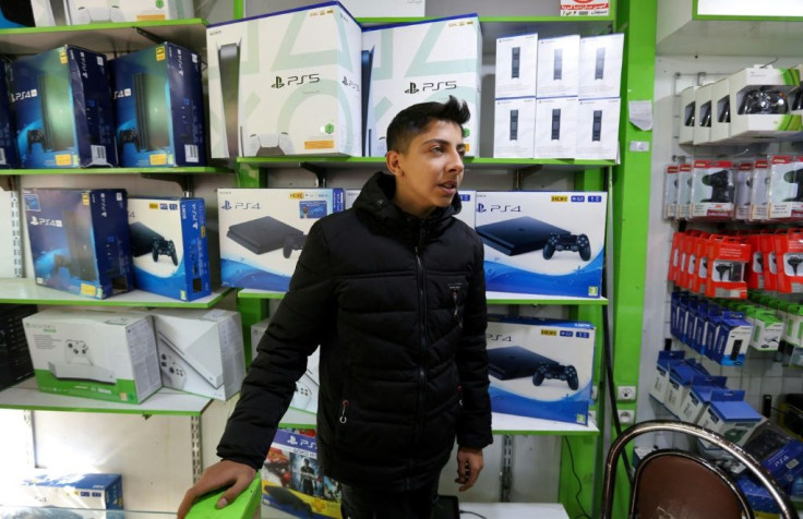 A vendor sells consoles at a shop in Tehran's central market. Neither Microsoft nor Sony are officially present in the Islamic republic due to Washington's punishing sanctions