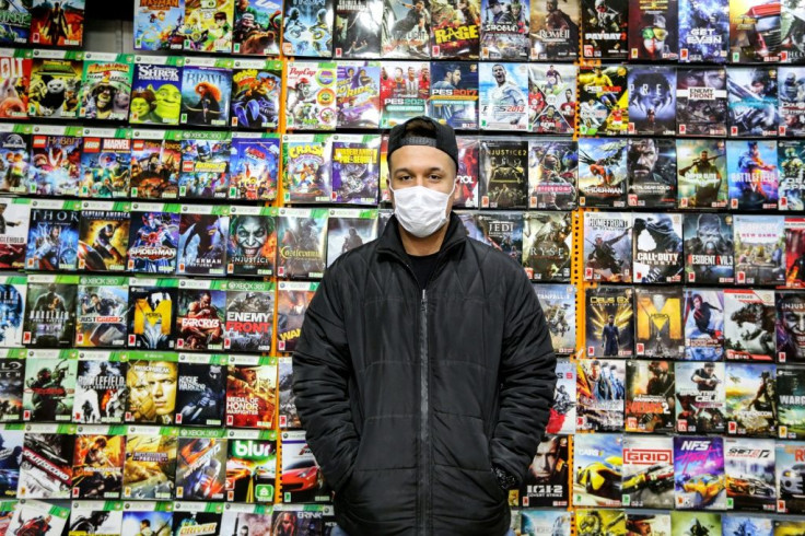 A vendor stands at a video game shop in Tehran's central market. Pro Evolution Soccer and Clash of Clans are reportedly among the most popular games in the Islamic republic