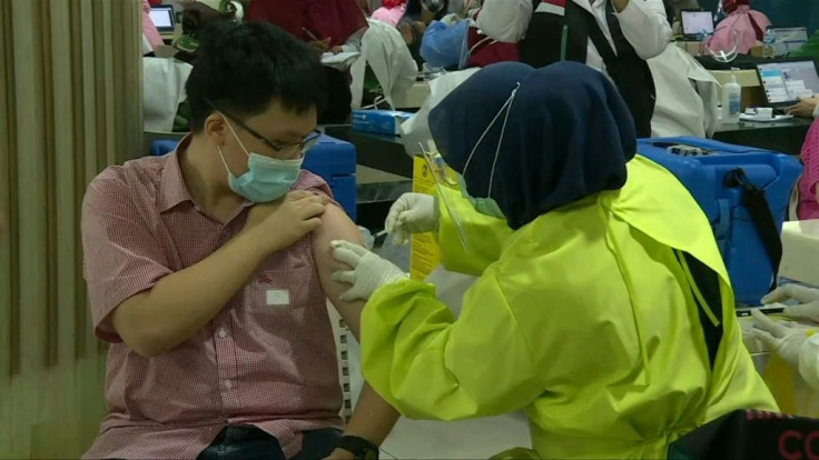 A food court has been turned into a vaccination centre in the Indonesian capital as market vendors get Covid jabs.