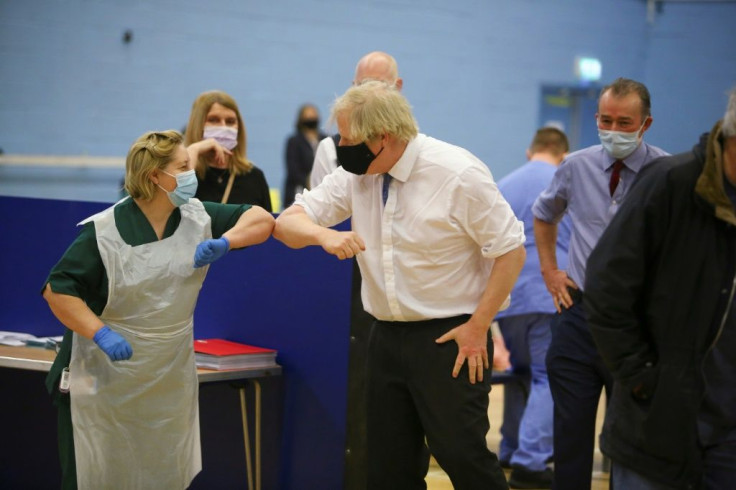 Britain's Prime Minister Boris Johnson visits a vaccination site at Cwmbran Stadium in Wales