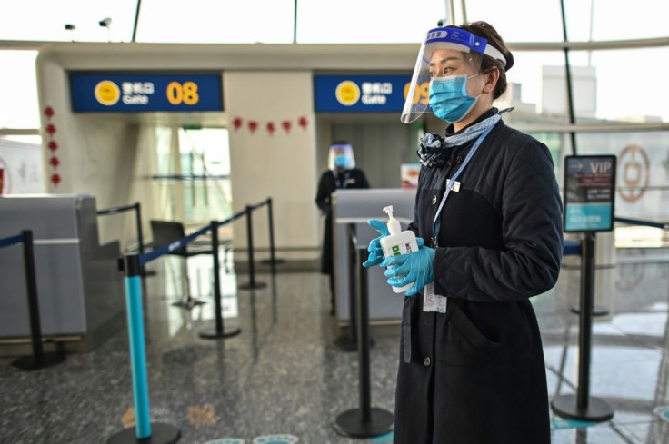 An airline worker wearing a face mask at the airport in Wuhan on February 12, 2021