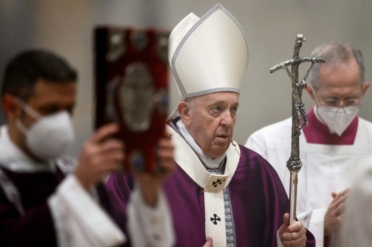 The coronavirus pandemic is forcing the Vatican led by Pope Francis (C) to dig into its cash reserves