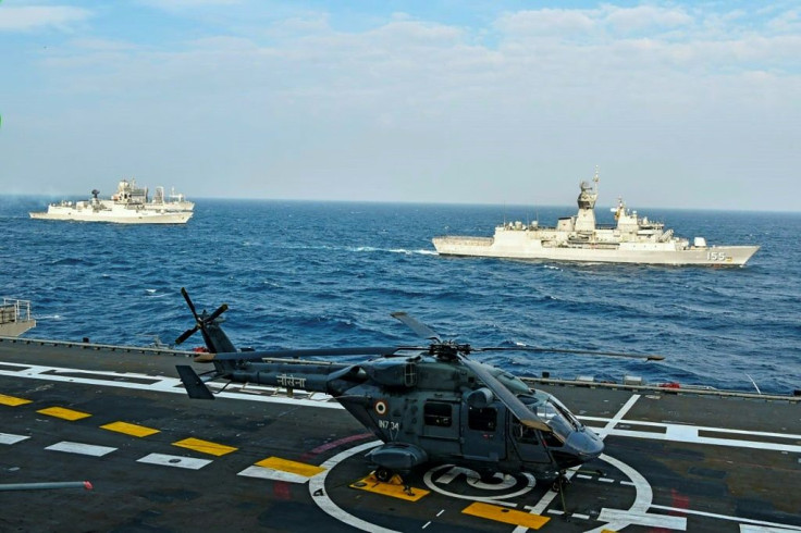 An Indian army helicopter sits on the deck on an aircraft carrier during the November 2020 Malabar naval exercise with Australia, Japan and the United States