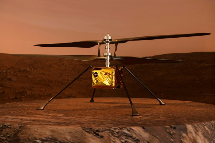 A full scale model of the experimental Ingenuity Mars Helicopter, which will be carried under the Mars 2020 Perseverance rover, is displayed at NASA's Jet Propulsion Laboratory