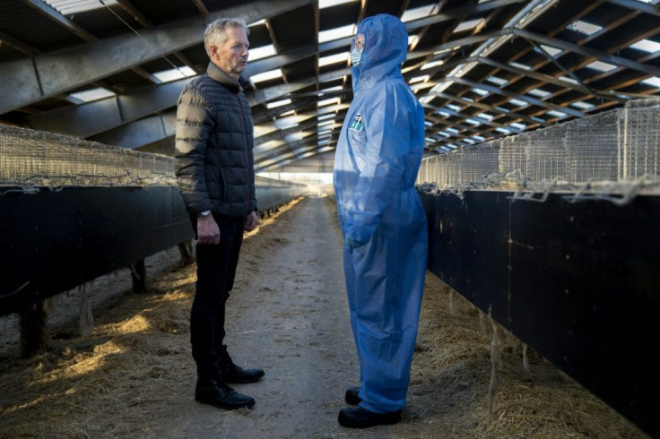 Denmark's Prime Minister Mette Frederiksen and mink breeder Peter Hindbo visit a closed and empty farm near Kolding, Denmark on November 26, 2020