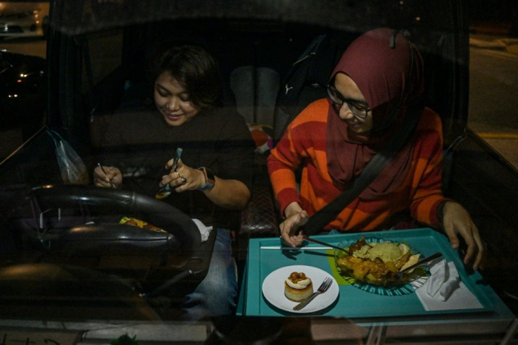 Lockdown-weary Malaysians have jumped at the chance for an unusual eating-out experience allowing them to enjoy restaurant food despite coronavirus curbs