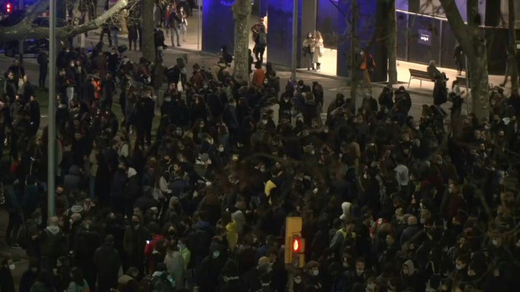 People in Barcelona demonstrate in support of rapper Pablo Hasel, who was jailed for tweets insulting police and the monarchy.