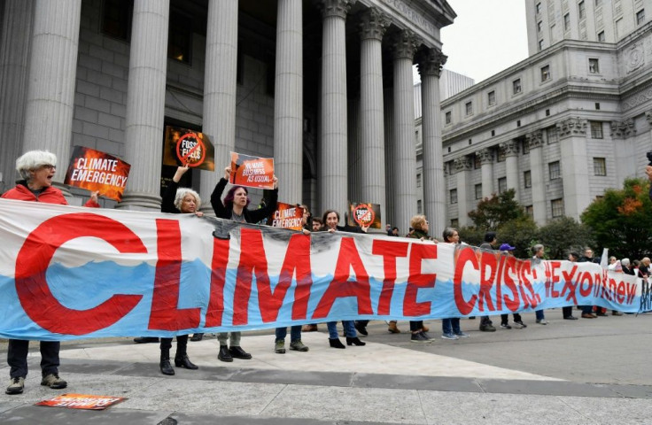 Climate protesters outside a New York court in October 2019 at the start of a trial of Exxon Mobil