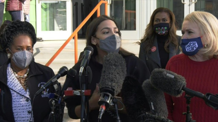 US congresswoman Alexandria Ocasio-Cortez of New York says the US must "rally together behind the needs of Texans" as she gives a statement before volunteering at the Houston Food Bank after a deadly winter storm