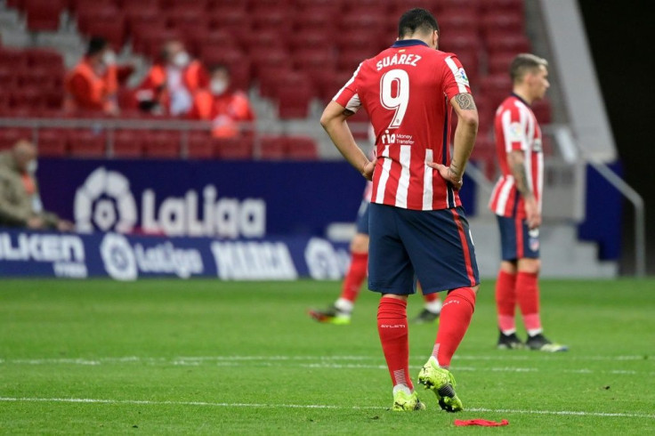 Atletico Madrid missed the chance to extend their lead at the top of La Liga on Saturday