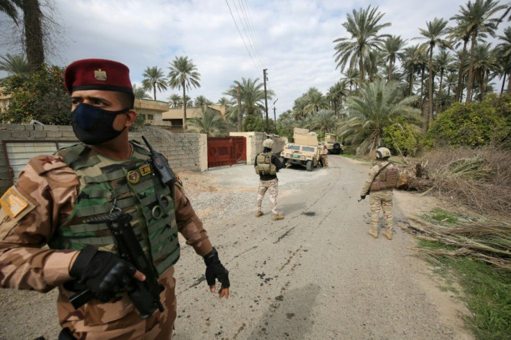 Iraqi forces search the Tarmiyah area, north of Baghdad, on February 20, 2021, following clashes with Islamic State group fighters
