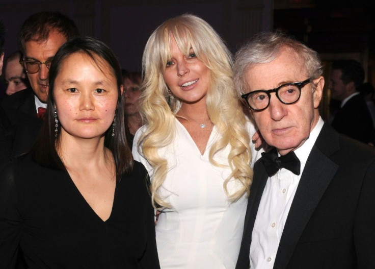 Director Woody Allen is seen with his wife Soon-Yi Previn (L) and actress/singer Lindsay Lohan at a New York fashion gala on February 8, 2012