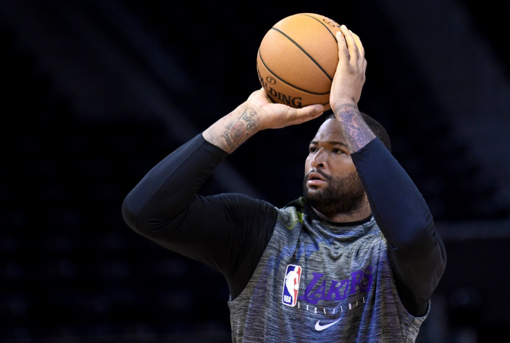 Los Angeles Lakers DeMarcus Cousins #15 works out shooting prior to the start of an NBA basketball game against the Golden State Warriors