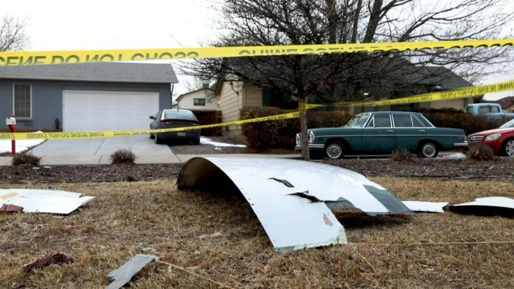 Police seal off a residential area in a Denver suburb after massive debris was dropped after a United Airlines flight suffered a fiery engine failure shortly after taking off from the Colorado capital on its way to Hawaii before managing a safe emergency 