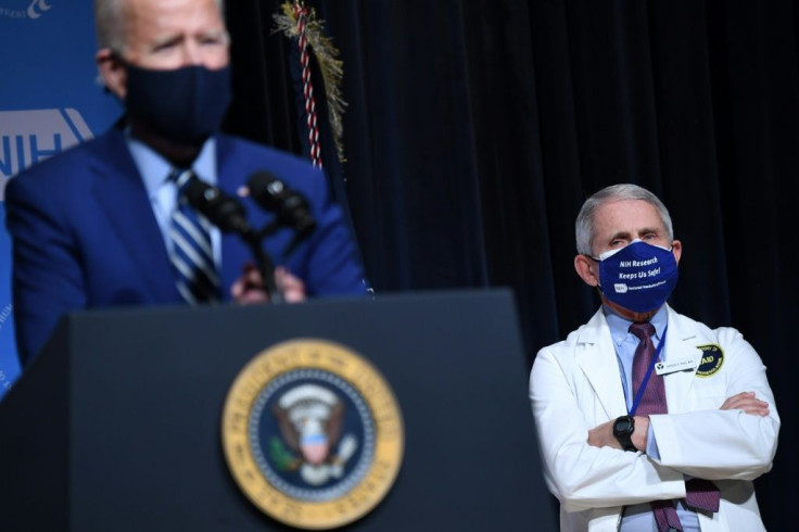 US President Joe Biden (L) appears alongside his top virus expert Anthony Fauci, who says a sense of normalcy may only return by the end of 2021