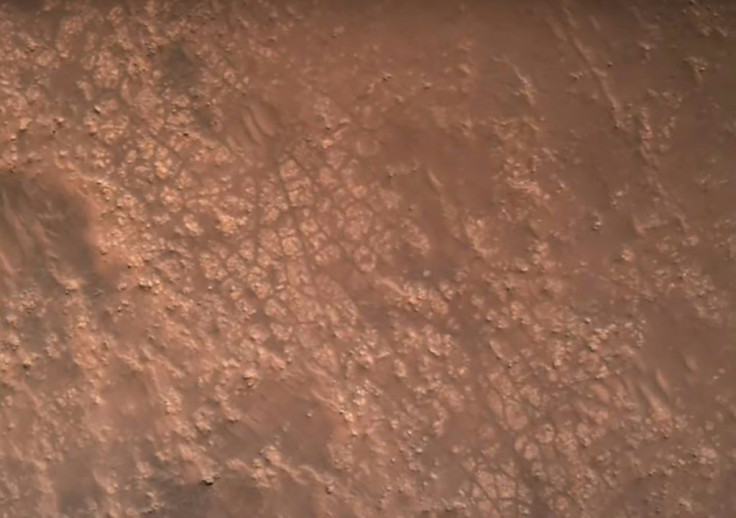 This NASA video frame grab photo released on February 22, 2021 shows the surface of Mars, captured by the Perseverance rover